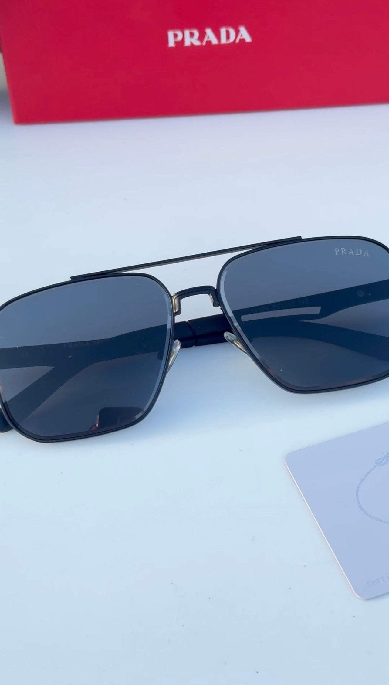 PRADA Noir 55 — Signature Metal Frame